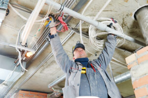 electrical worker fixing wires