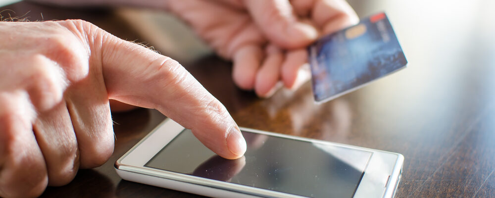 Person making payment on mobile device