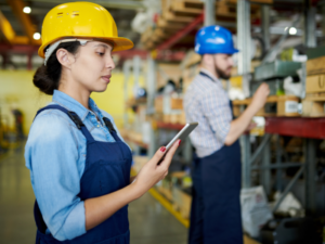 Woman holding mobile app in warehouse