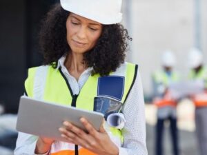 site manager filling out OSHA compliance forms on tablet