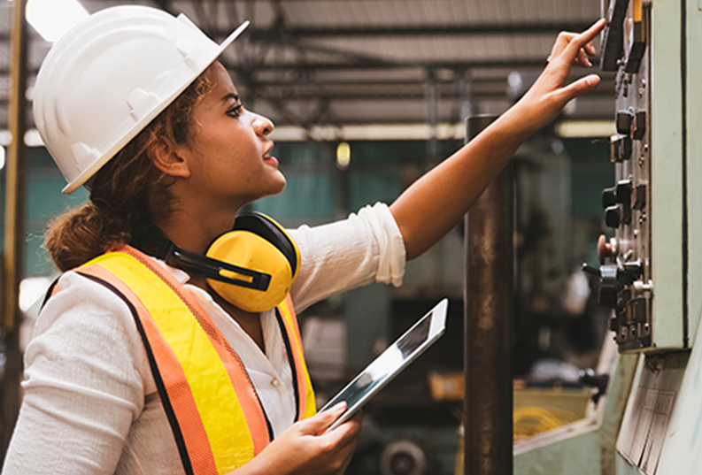 Image of woman inspecting maintenance equipment