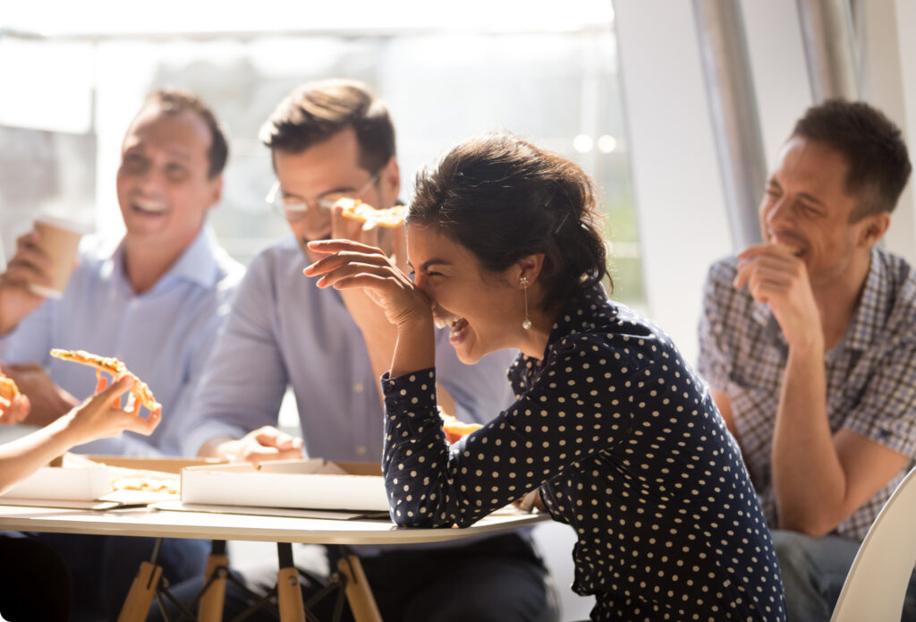 laughing woman at table