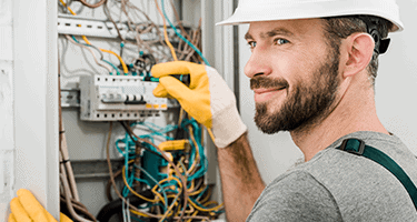 A electrician inspecting equipment.